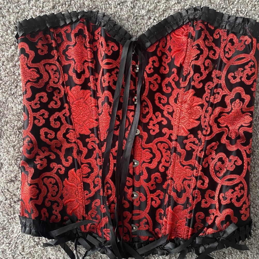 Red & black corset. Needs ribbon for tying in back